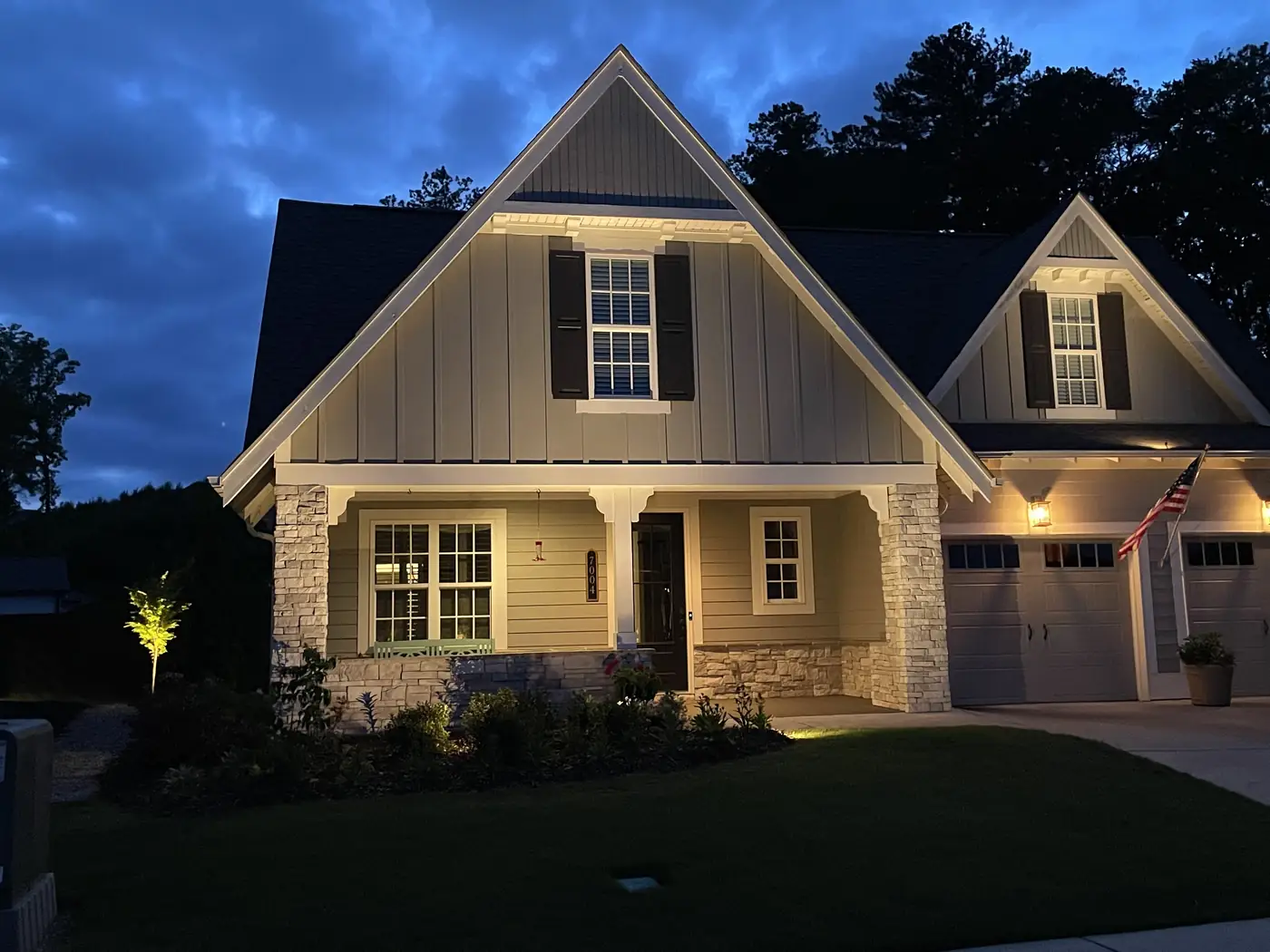 Craftsman cottage outdoor lighting at dusk Alabama