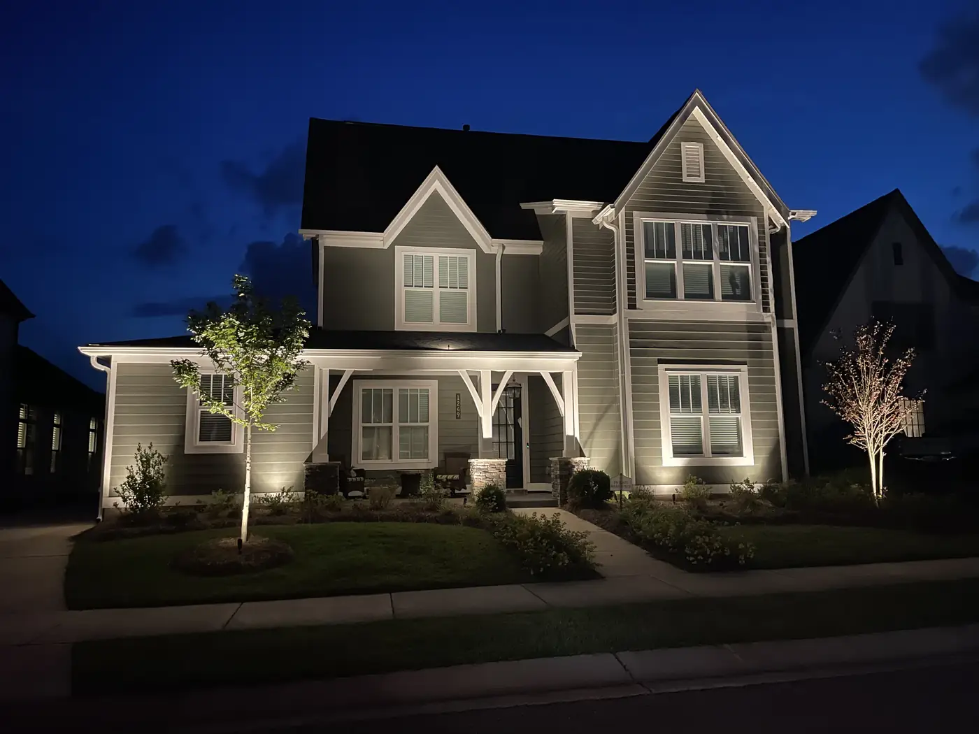 Craftsman home landscape lighting dusk Alabama