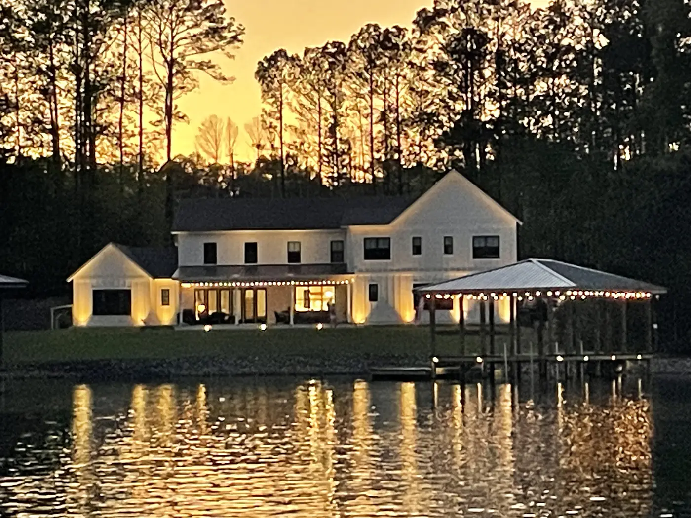 Lake Martin Alabama lakehouse lighting at sunset