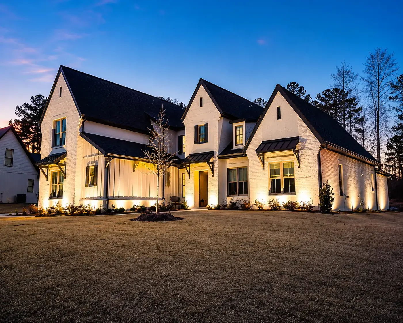 White painted brick home landscape lighting Alabama